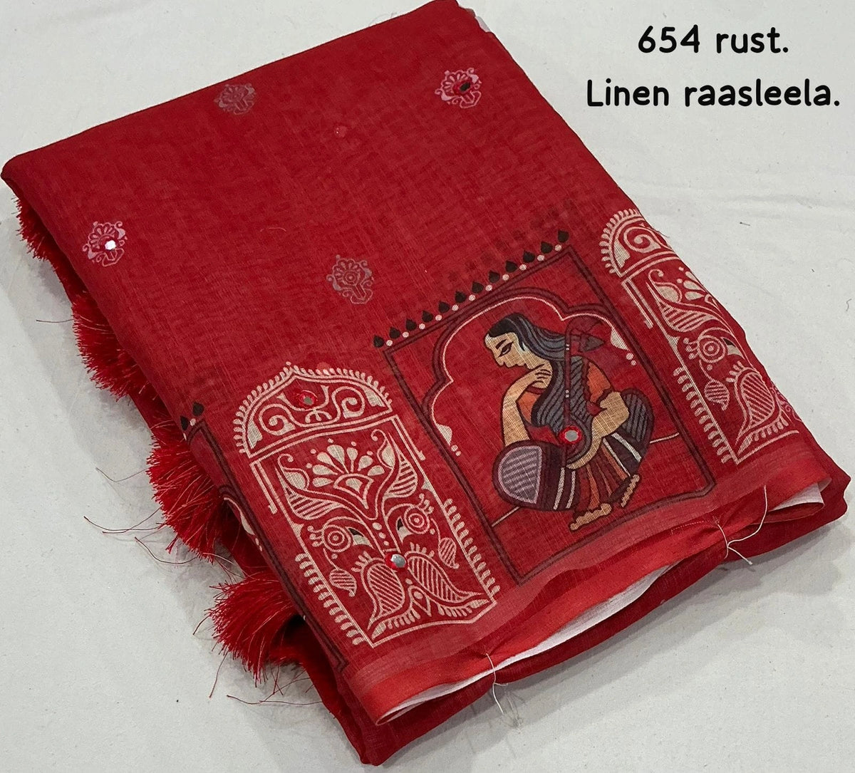rust saree with tassels